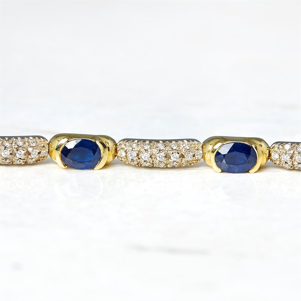18k Yellow & White Gold - total weight 87.58 grams 18k Yellow & White Gold 12.48ct Sapphire & 1.24ct Diamond Necklace, Bracelet & Earrings Suite