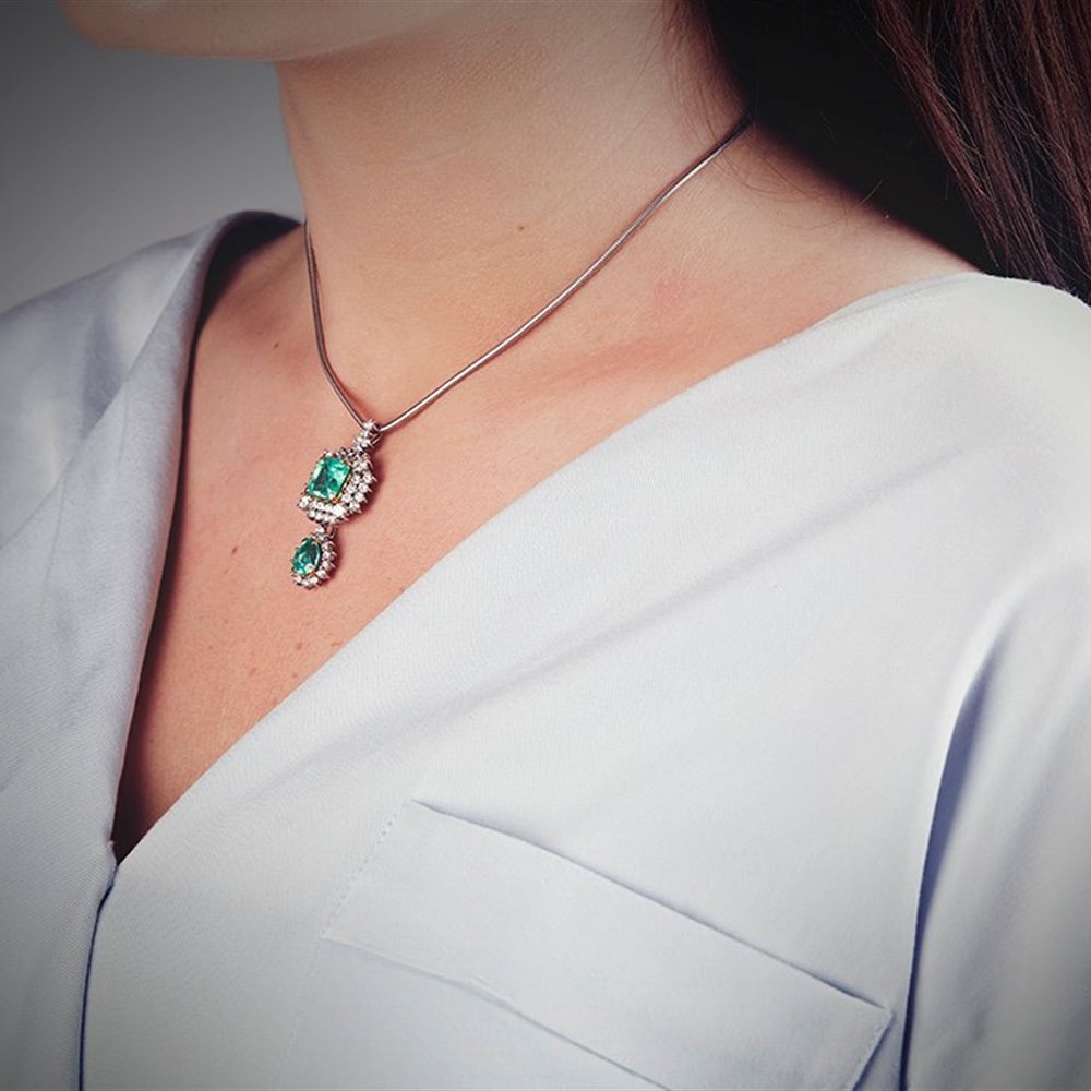 18k White & Yellow Gold (the 2 4 claw settings holding the emeralds are 18k Yellow Gold) 18k White Gold 3.50ct Colombian Emerald & 3.00ct Diamond Necklace