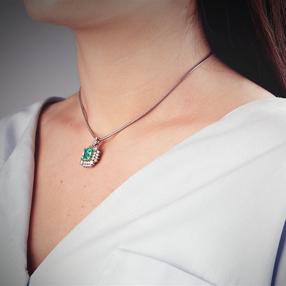 18k White & Yellow Gold (the 2 4 claw settings holding the emeralds are 18k Yellow Gold) 18k White Gold 3.50ct Colombian Emerald & 3.00ct Diamond Necklace