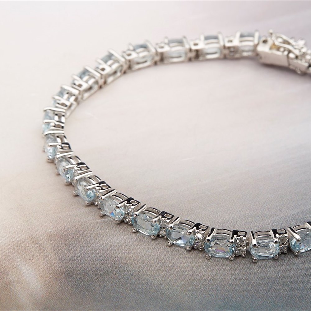 18k White Gold, total weight 69.9 grams 18k White Gold Aquamarine & Diamond Bracelet, Earrings & Necklace Suite
