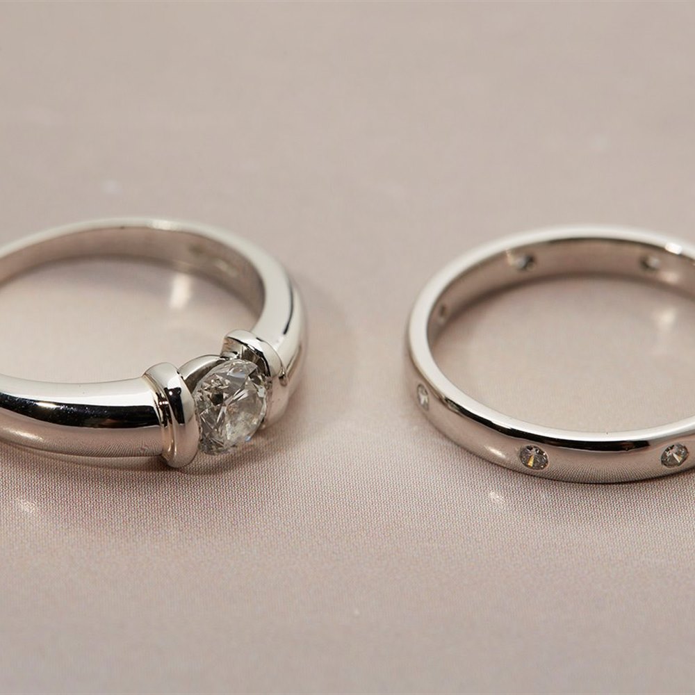 Platinum - total weight of Engagement Ring - 6.21 grams. Total weight of Wedding Band - 4.26 grams.  Platinum Diamond Engagement & Wedding Ring Set