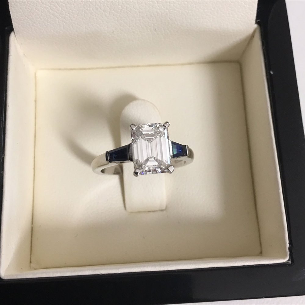 Platinum, total weight - 4.84 grams Platinum Emerald Cut 1.70ct F VVS1 Diamond & 0.44ct Sapphire Engagement Ring